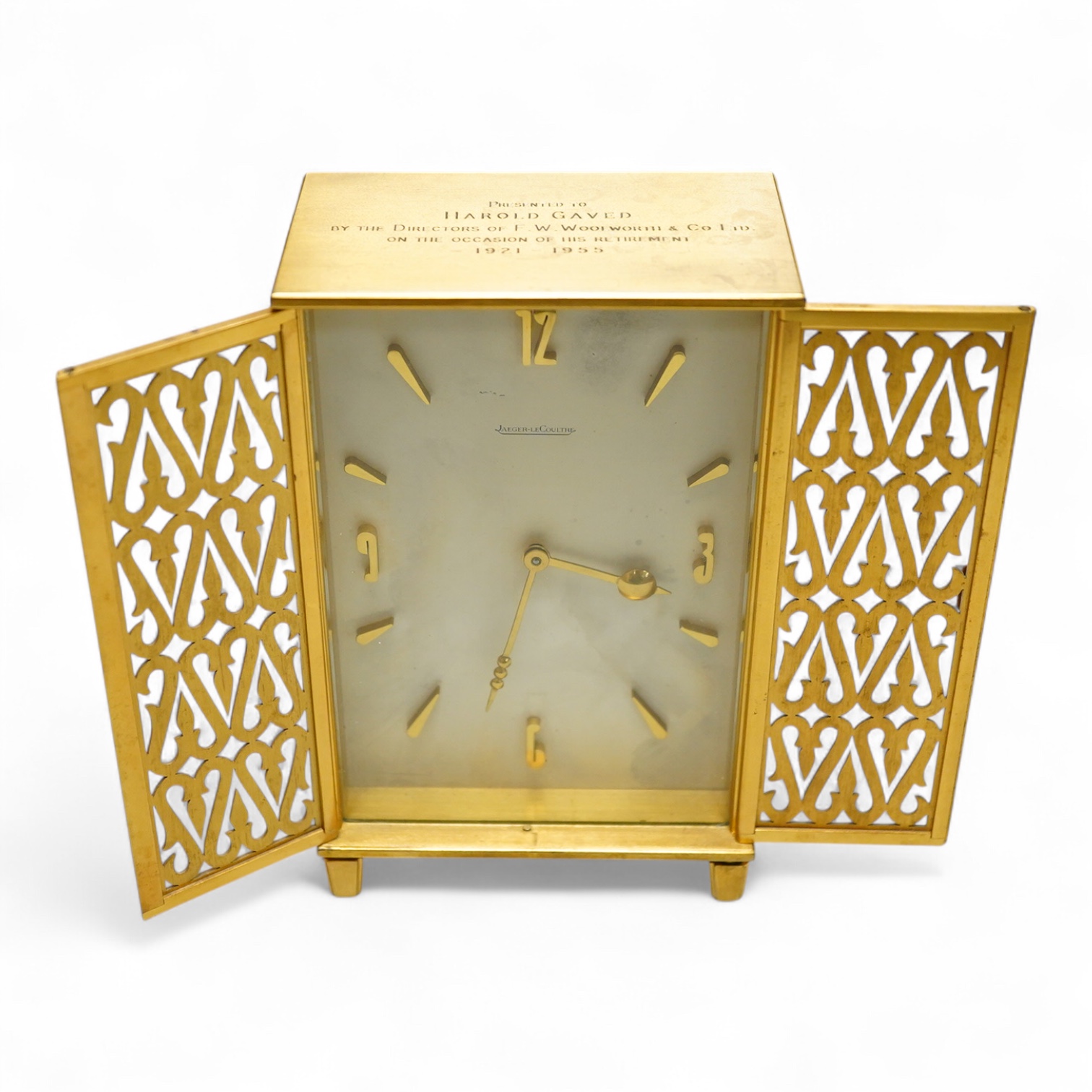 A Jaeger LeCoultre timepiece in the form of a wardrobe with pierced doors, one leg missing, 16cm high